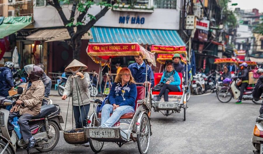Hanoi: Cyclo the Old Quarter and Egg Coffee Tour - Walking through Hoan Kiem with a local guide