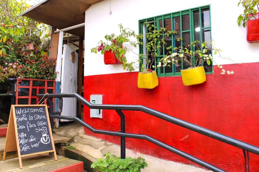 Medellín Coffee Farm Tour with Trolley and Cable Car Ride - Walking through Barrio La Sierra